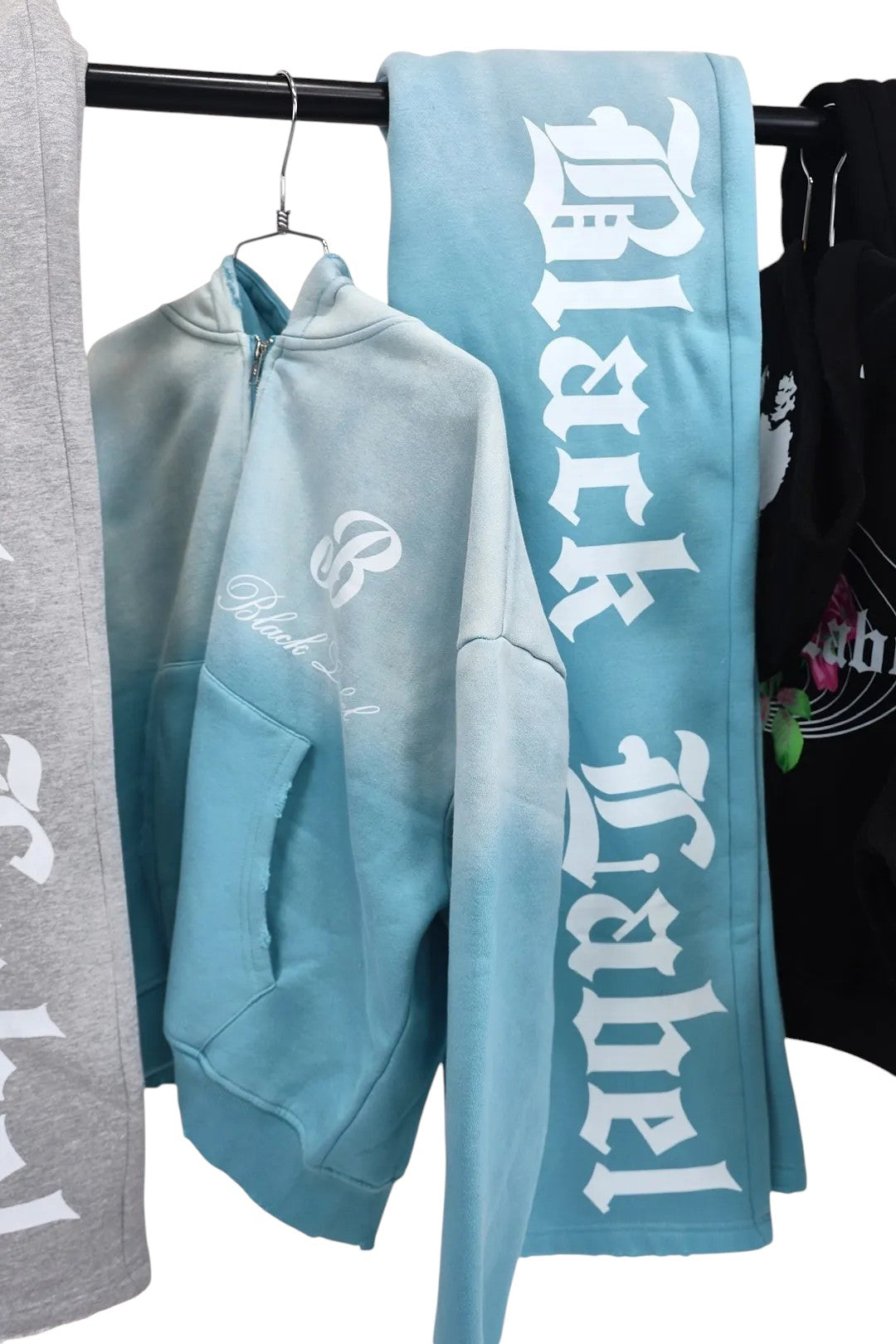 Black Label Clothing Brand blue tie-dye zip-up hoodie with distressed graphic and raw hem. Soft, comfortable fabric with ombre effect.