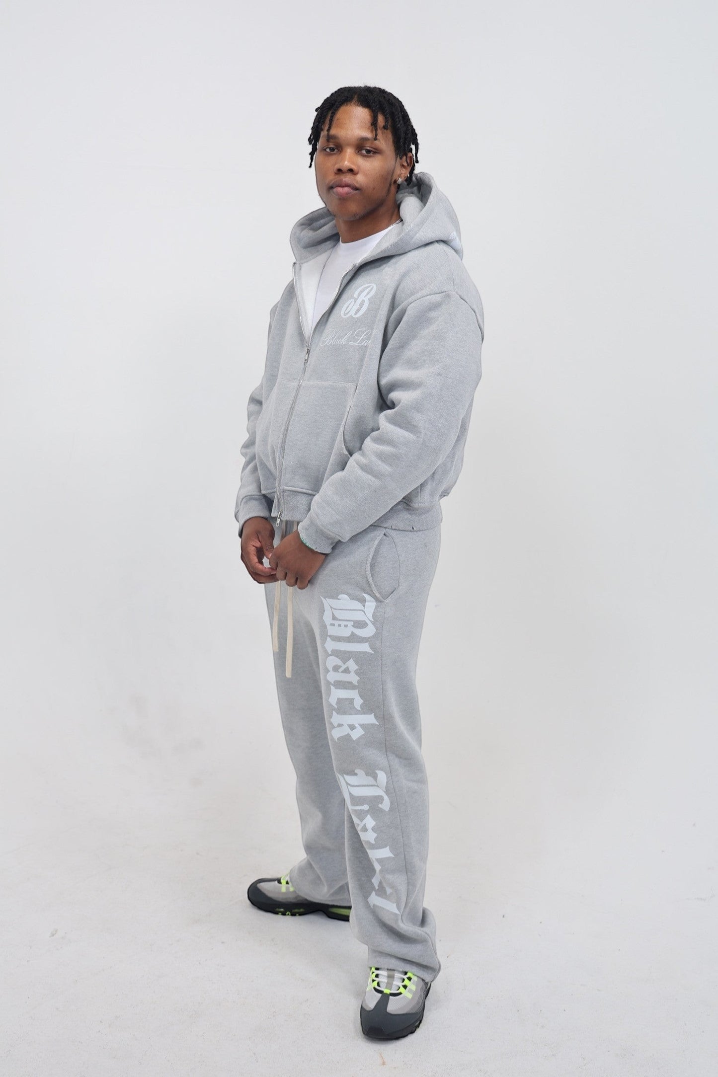 Black Label Clothing Brand grey heavyweight cotton sweatsuit with acid wash finish and bold graphics. Oversized fit.